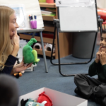 Demonstrating Monster Phonics in the classroom with phoneme toys